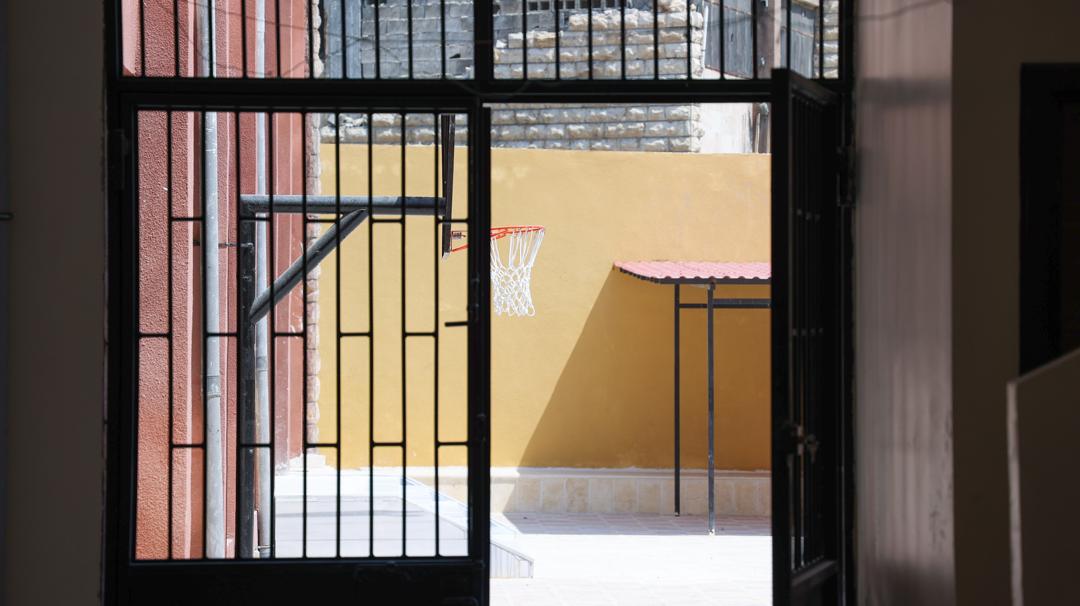 Finished doorway and school courtyard